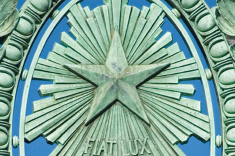 This detail atop Sather Gate displays the University of California motto, "Fiat Lux" (Let There Be Light).